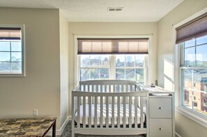 A baby crib in a room with large windows, a desk, and a filing cabinet. - Harrisonburg Retreat w/ Hot Tub ~ 2 Mi to JMU (Harrisonburg)
