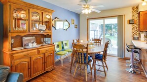 A dining area with wooden cabinetry, a ceiling fan, and a view of the outdoors. - Pennsylvania Countryside Retreat w/ Deck + Yard! (Parker)