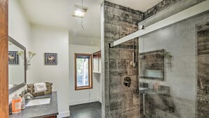 A modern bathroom with a glass-enclosed shower, a vanity with a sink, and a mirror. - 'moose Park Lodge' Charming Walden Retreat! (Walden)