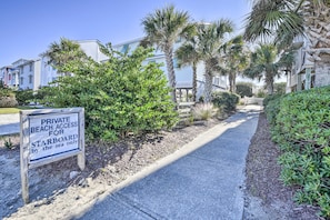 A private beach access sign for Starboard by the sea.