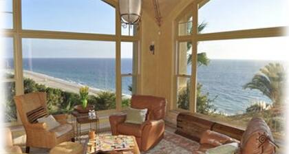 Stunning Malibu Oceanfront Estate w/ 2 Guesthouses, Pool, Tennis Court