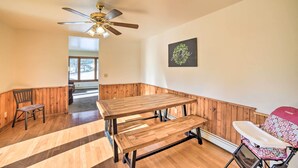 A room with a wooden bench, a ceiling fan, and a view of a snowy landscape through a window. - Charming Wisconsin Getaway w/ Nearby Lake! (Pound)
