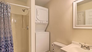 A bathroom with a shower, toilet, and sink. - 7 Mi to Lake Harmony: Home w/ Furnished Deck! (Albrightsville)