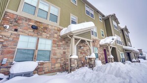 A multi-story building with a stone facade and multiple windows. - Spacious Townhome ~ 7 Mi to Deer Valley Resort! (Heber City)