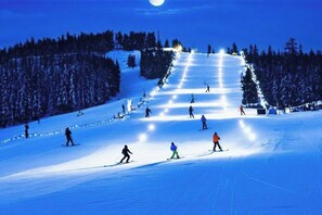A ski slope with skiers descending. - Two Ski Mountains Cozy Poconos Getaway (White Haven)