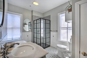 A bathroom with a glass-enclosed shower, a large sink, and a toilet. - Walk to Downtown: Pet-friendly Millerton Home! (Millerton)