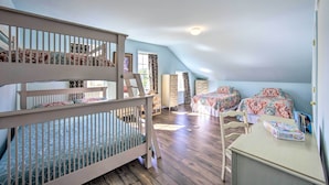A bedroom with a bunk bed, a desk, and a dresser. - Unique Townhouse in Bavarian-style Neighborhood! (Adamstown)