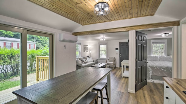 A modern kitchen with a large island, wooden ceiling, and large windows overlooking a garden. - Updated Bristol Retreat ~ 2 Miles to Downtown! (Bristol)