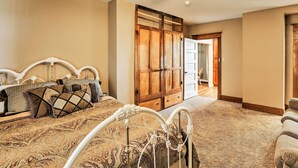 A bedroom with a bed, a wardrobe, and a ceiling fan. - Wyoming Farmhouse Retreat! 10 Mi to Bighorn Canyon (Lovell)