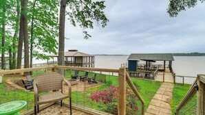A wooden deck with outdoor seating, a gazebo, and a view of a body of water. - Waterfront House on Toledo Bend w/ Private Dock! (Many)