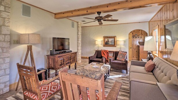 A spacious living room with a wooden ceiling, a television, a fireplace, and a comfortable seating area. - Georgetown Barn Studio on > 7 Acres: Pet Friendly! (Georgetown)