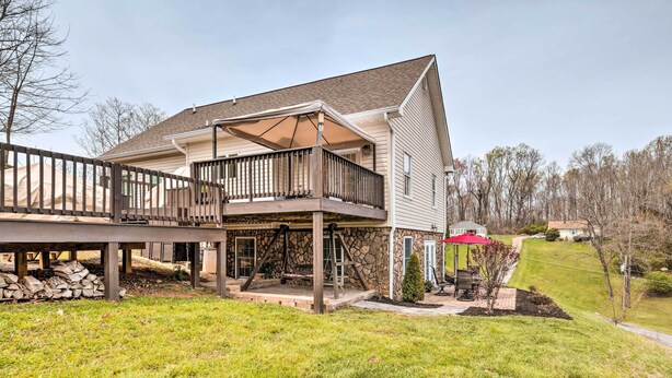 A two-story house with a covered porch and a deck. - Bristol Escape w/ Patio, 2 Mi to Downtown! (Bristol)