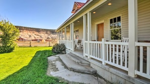 A house with a porch, steps, and a view of a hilly landscape. - Custom Home w/ Decks in Boulder! Gateway to Parks! (Boulder)