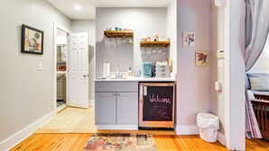 A compact kitchen with a chalkboard sign, a coffee machine, and a sink. - Historic Bemus Point Studio w/ Porch: Walk to Lake (Bemus Point)