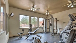 A gym with ceiling fans, exercise equipment, and large windows. - Kanab Condo w/ Pool & Patio, 30 Mi to Zion NP (Kanab)