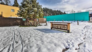 A snowy outdoor area with a sign reading "COGWILD." - Oregon Getaway by Willamette National Forest! (Oakridge)