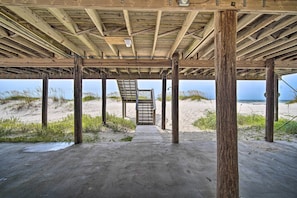 A wooden pier structure with a concrete walkway leading to a bench and a staircase. - Sunny Gulf Shores Haven, 3 Mi to Fort Morgan! (Gulf Shores)