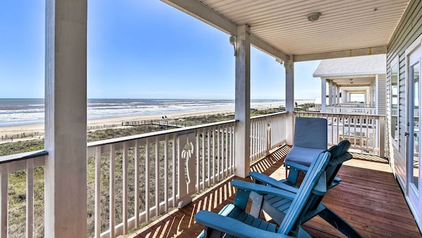 A covered porch with a view of the beach, wooden deck, and a chair. - Gulf-view Home w/ Dog Run in Surfside Beach! (Freeport)