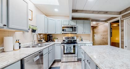 Dog-friendly waterfront home with a firepit, grill, deck, board games, & dock