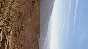 A rugged canyon landscape with a clear sky. - Nabati Hostel  (At-Taybeh)