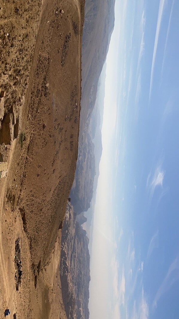 A rugged canyon landscape with a clear sky.