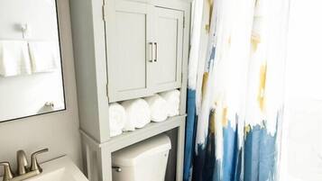 Bathtub, hair dryer, towels