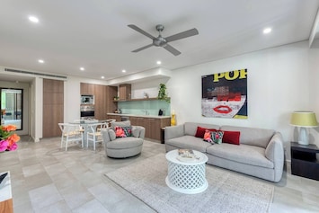 Chic open living is tastefully designed with a touch of metro-style, creating a comfortable and cosy space to come home to.