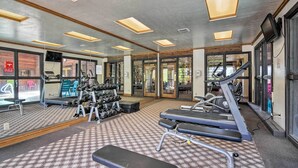 A gym with treadmills, dumbbells, and exercise equipment. - Cozy Brian Head Condo Near Hiking & Biking! (Brian Head)