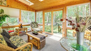 A wooden interior with a sofa, chairs, a table, and a glass table with a vase. - Walk to Dining! Townhome 1 Mi to Big Boulder Mtn (Lake Harmony)
