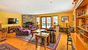 A cozy living room with a fireplace, comfortable seating, and a television. - Mountaintop Ellicottville Home: 7 Mi to Ski Resort (Ellicottville)