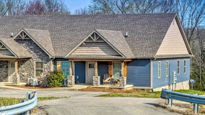 A building with a stone facade, a blue exterior, and a sloped roof. - Pet-friendly Brownsville Retreat w/ Porch! (Brownsville)