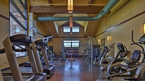 A gym with treadmills, ellipticals, and weight machines. - Large Deck & Fire Pit: Secluded Pocono Lake Home (Pocono Lake)