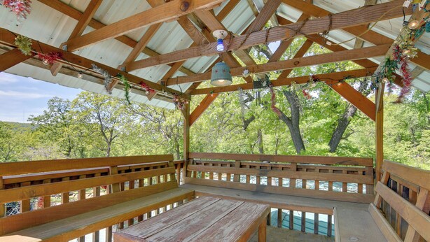 A wooden pavilion with benches and a table, surrounded by trees. - Serene Green Forest Hideaway w/ Spacious Yard (Green Forest)