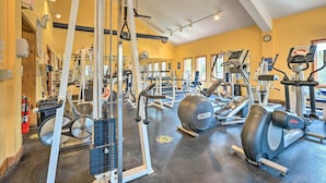A gym with various exercise equipment, including treadmills, elliptical machines, and weight machines. - Timber Creek Townhome w/ 2 Decks & Mtn Views! (West Dover)