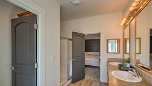 A modern bathroom with a vanity, sink, and large mirror. - Tranquil Indigo Getaway < 3 Mi to Hot Pools! (Lava Hot Springs)