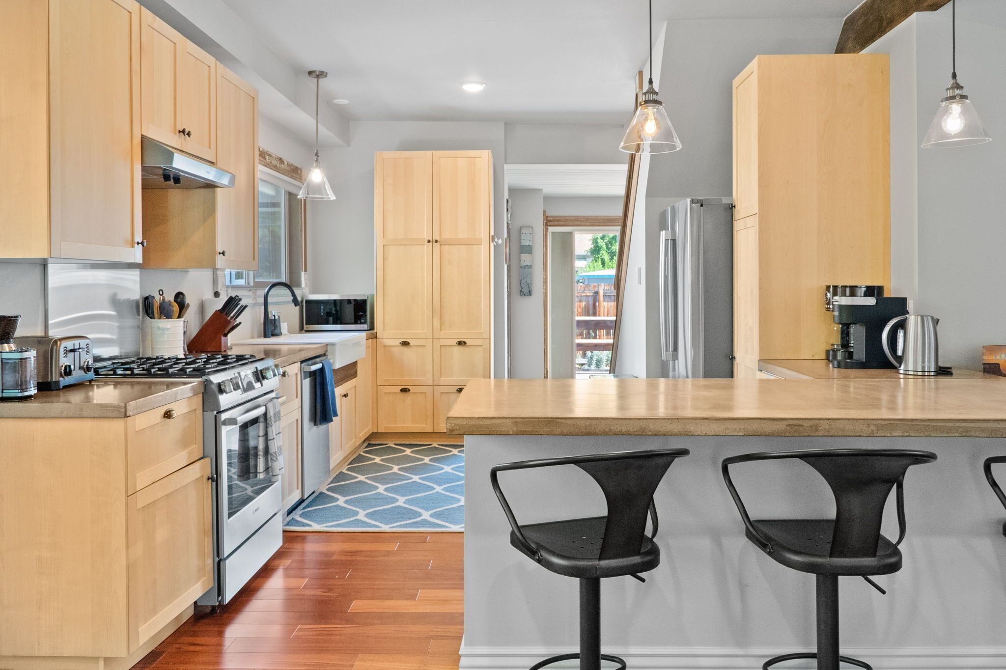 Modern downtown Victorian with open living/kitchen.