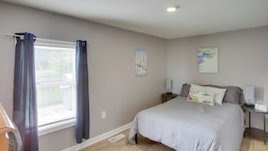 A bedroom with a bed, two bedside tables, a window with curtains, and a ceiling light. - Albany Family Lake Getaway Near State Parks! (Albany)