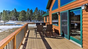 A wooden building with a deck, large windows, and a view of trees and snow. - Keystone Cabin ~ 9 Mi to Mt Rushmore! (Hermosa)