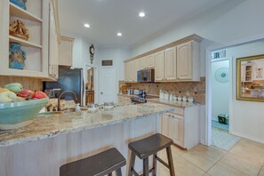 A spacious kitchen with a large island, built-in appliances, and ample counter space. - 'the Crown Goose' - Bullard Home w/ Pool & Spa! (Bullard)