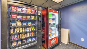 Two vending machines with snacks and beverages, one with Dr. Pepper and the other with various brands. - Resort Amenities: Beech Mtn Condo Near Skiing! (Banner Elk)