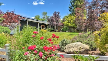 Stroll through the beautifully maintained garden, surrounded by vibrant flowers and lush trees.