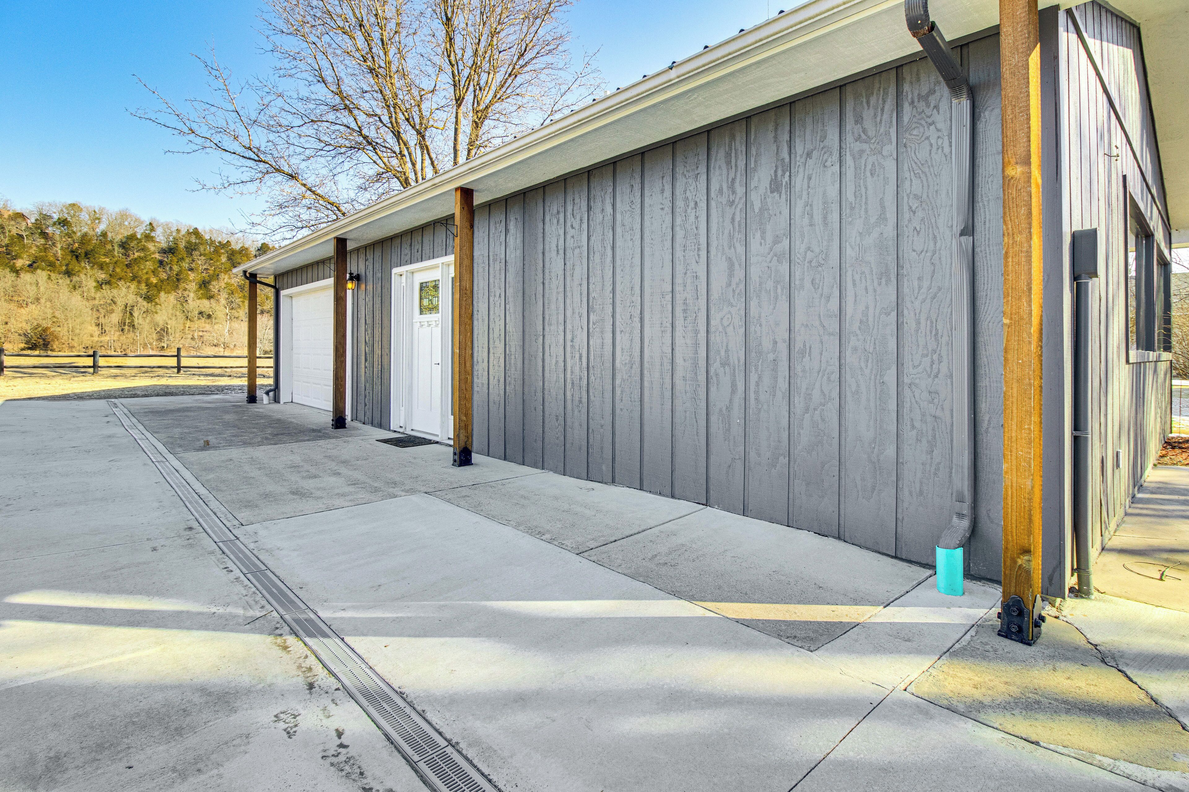 A building with a grey exterior, a door, and a window.