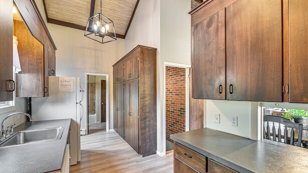A kitchen with wooden cabinets, a stainless steel sink, and a countertop. - Newcomb Retreat w/ Mountain Views & Fire Pit! (Newcomb)