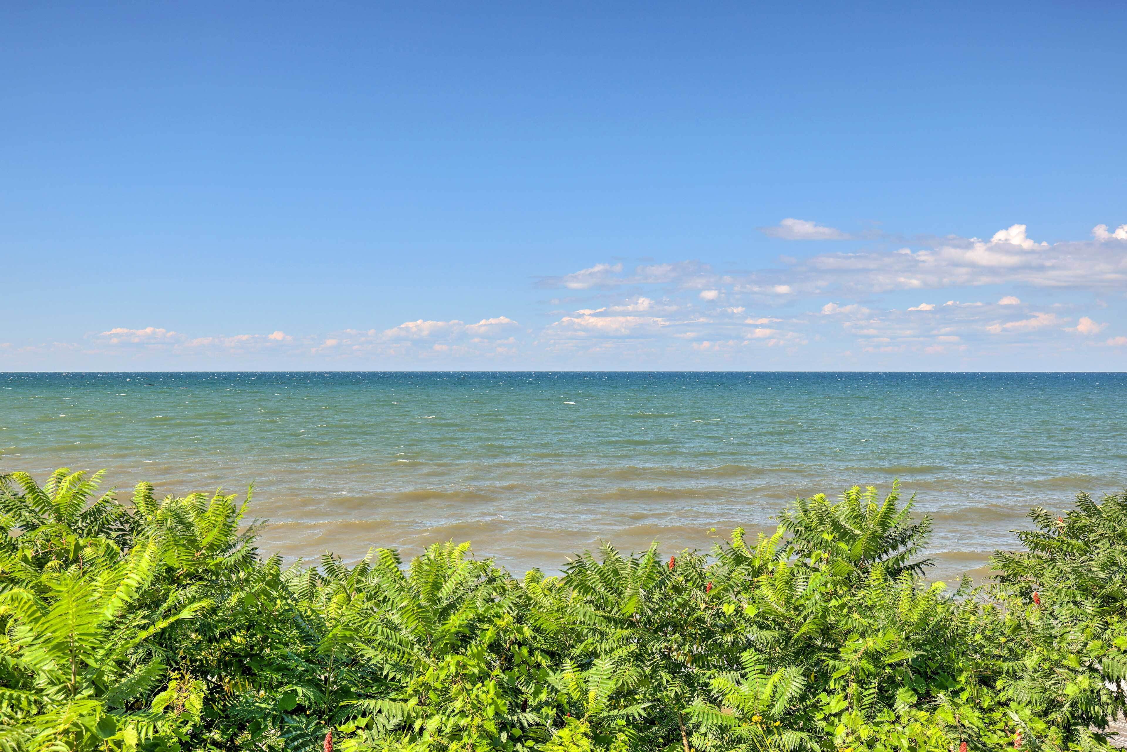 A coastal view with clear skies and calm waters.