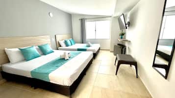Deluxe Quadruple Room | Premium bedding, down comforters, Select Comfort beds, desk
