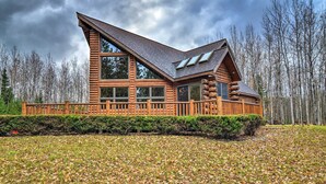 A log cabin with a large deck and multiple windows. - 'camp Tony' w/ Trail Access: Walk to Lake Huron! (Millersburg)