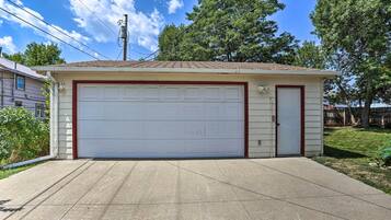 A single-story house with a garage, a front door, and a small porch area.