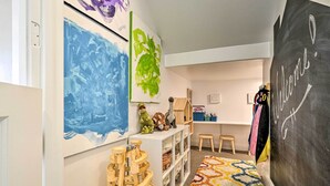 A room with a chalkboard wall, wooden play structures, and colorful artwork. - Utah Group Getaway w/ Patio! Swim, Soak & Hike (Washington)