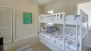 A bunk bed room with a window, a door, and a motivational quote on the wall. - Boat Dock, Personal Watercraft: Lake Hamilton Home (Hot Springs)