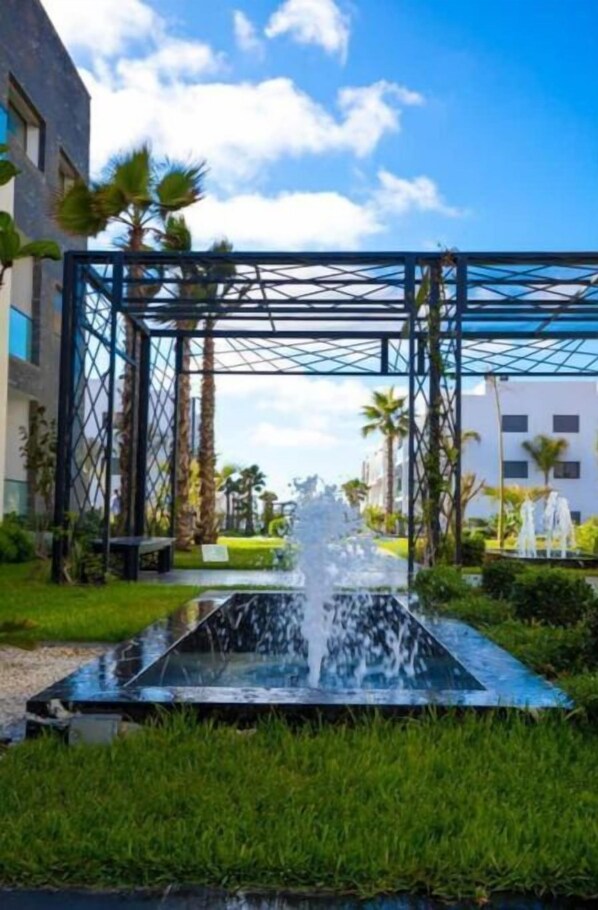 Property grounds - Apt Tamaris/Sidi Rahal sea view, feet in the water (Tamaris)